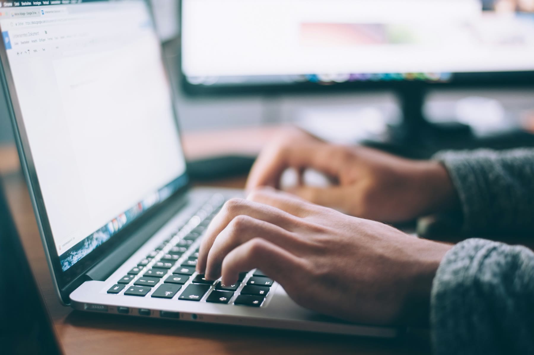 Person working at a laptop, answering the next inquiry instead of decorating a sequence